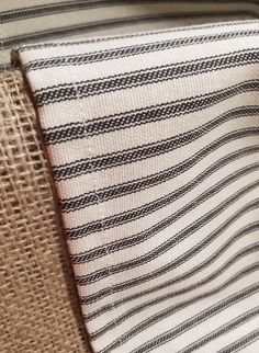 a close up of a piece of cloth on a chair with burlap material