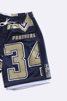 Unisex American Football shorts upcycled from NFL jersey patchwork pieces and deadstock mesh. Featuring pockets and an elasticized waistband with drawstrings. Sourced and reworked in Canada DetailsSize: Women's S, Men's XSCondition: Good vintage conditionColour: Navy, gold, white