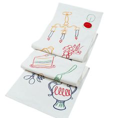 three napkins with designs on them sitting next to each other in front of a white background