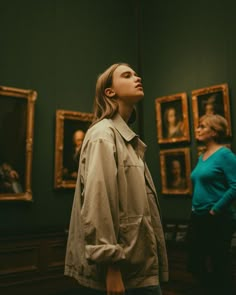 a woman looking up in an art gallery