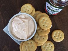 crackers and dip in a bowl on a table