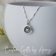 Always & Forever - this petite .925 sterling silver necklace makes a great Valentine's Day gift, bridal necklace, gift for mother/daughter, or a special someone in your life. This tiny wax seal heart dangles from an Italian made box or rolo chain. It is lightweight and prefect for everyday wear. Necklace comes ready for gifting in a jewelry box. Crafted out of recycled .925 sterling silver both the charm and chain are nickel-free. Dimensions:  Heart charm: 13mm long x 10mm wide Matching earrings Delicate Silver Charm Necklace For Mom, Delicate Sterling Silver Charm Necklaces As Gift For Mom, Dainty Charm Necklace Gift, White Gold Charm Necklace For Mom, Dainty Silver Charm Necklace For Mom, Classic Charm Necklace For Mother's Day Gift, Sterling Silver Initial Pendant Necklace For Anniversary, Sterling Silver 925 Stamped Charm Necklaces As Gift, Personalized Silver Charm Necklace For Anniversary