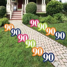 there are nine yard signs in front of a house with the number 99 on them