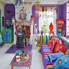 a living room filled with lots of colorful furniture and decor on top of white floors