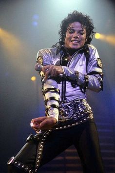 michael jackson performing on stage with his guitar