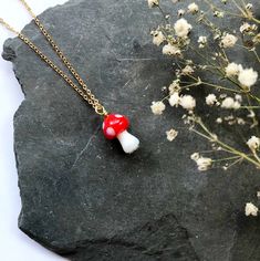 * Free UK Delivery on all orders * Free Worldwide Shipping on Jewellery and Suncatcher orders totalling £40 or more with code FREEWORLD40 (this offer is only eligible for items which feature this discount info - other larger items aren't included due to weight which increases the shipping cost) Welcoming Autumn with the sweetest woodland toadstools! Each red and white glass mushroom is handmade and unique, complimented with gold plated components and a vintage iridescent sequin base. Components: Mushroom Necklace, Mushroom Jewelry, Glass Mushrooms, Iridescent Green, Gift Envelope, Green Sequins, Necklace Choker, Gold Plated Chains, White Glass