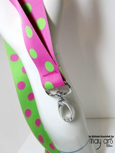 a white mannequin with pink and green polka dots on it