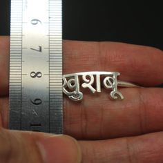 "Personalized Hindu Name Bracelet is handmade with its own uniqueness. It can be bought as a gift for any occasion like birthday gift, wedding gift, travel gift, souvenir and etc. If you need rose gold plating or yellow gold plating, please contact us, we will advice you on the additional fees applicable. Base Material: Sterling Silver Size: 11mm (Approximately) Bangle wrist size: 7'' - 8'' Inches. Adjustable / Please give us your wrist circumference. Stone: Red CZ setting (Default) Or check wit Spiritual Engraved Name Bracelet For Gift, Spiritual Engraved Name Bracelet Gift, Spiritual Jewelry With Custom Name For Gift, Silver Name Bracelet With Initials For Wedding, Handmade Silver Bracelet For Birthday, Spiritual Name Bracelet For Mother's Day, Handmade Silver Bracelets For Birthday, Symbolic Personalized Bracelets As Gifts, Spiritual Name Jewelry For Weddings