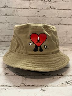 Un verano sin ti bucket hats now available!!  We have them in tan color and dodger blue!! comes in 2 sizes S/M and L/XL  any questions please feel free to message!! Get ready for the concerts and get your fit!! Bunny Bucket Hat, Cricket Joy Projects Craft Ideas, Cricket Joy, Cool Bucket Hats, Cute Bucket Hats, Bunny Heart, Custom Bucket Hats, Concert Merch, Dodger Blue