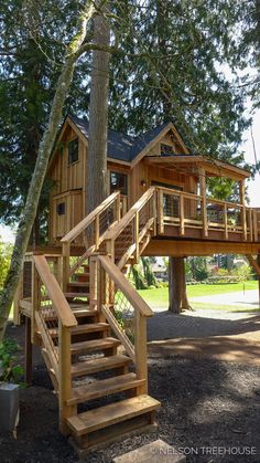 a tree house with stairs leading up to it