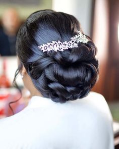 the back of a woman's head wearing a hair comb