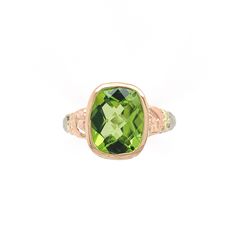 All of our jewelry is guaranteed authentic by our Graduate Gemologist of the Gemological Institute of America (GIA). 14k White Gold 3.24 Carat Cushion Cut Genuine Natural Peridot Ring (#J6551) Vintage 14k gold filigree ring with rose gold flowers and green gold leaves featuring a cushion cut peridot. This beautiful bright lime green color peridot weighs 3.24 carats and measures about 10mm x 8mm. This is a specialty cut cushion with a checkerboard top.  The ring fits a size 7.25 finger, weighs 1. Luxury Green Gemstones For Anniversary, Luxury Peridot Rings With Accent Stones, Luxury Peridot Ring For Formal Occasions, Luxury Green Ring With Bezel Setting, Luxury Green Rings With Bezel Setting, Luxury Peridot Jewelry With Accent Stones, Fine Jewelry Peridot Gemstones For Formal Occasions, Formal Peridot Gemstones For May Birthstone, Luxury Green Cushion Cut Jewelry