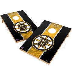 two black and gold boston hockeys cornhole game boards with the logo on each side