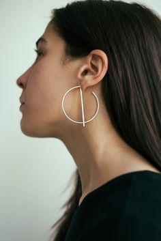 Let it happen 925 silver big hoops with bar, big hoop earrings, dangle bar earrings, dangling hoops, designer hoops, minimal hoops Big hoops made in sterling silver by Meberr Studio. Diam: 5 cm / 2 in The bar is detachable and it can be used in front or behind the earlobe ;) * For reasons of hygiene exchanges and returns of earrings will not be accepted. * Every item arrives inside a nice jewelry gift box wrapped in a bubble bag for protection. * For wholesale inquiries please send me an inbox m Modern Crescent Brass Hoop Earrings, Modern Geometric Single Hoop Earring, Modern Plated Brass Hoop Earrings, Modern Crescent-shaped Hoop Earrings, Contemporary Silver Hoop Earring, Minimal Hoop Earrings, Let It Happen, Earrings Minimal, Earrings Dangling