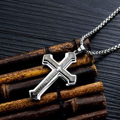 This black silver stainless steel cross pendant necklace for men is crafted to be allergy-free and resistant to fading. It features gold plating, a hard texture, and is tarnish-resistant and nickel-free. The pendant is engraved with the English Lord's Prayer, making it a meaningful and holy gift for those with religious beliefs. The pendant measures 2.55 inches (6.5 cm) in length and 1.6 inches (4.1 cm) in width, and it comes with a sturdy 23.6-inch (60 cm) stainless steel chain. Its fashion-forward, contracted design allows it to be worn as a standout piece, reflecting individual character and style. Originating from biblical tradition, the cross symbolizes humility and sacrifice, and is a powerful reminder of faith and transformation. Available in four colors, this necklace is a timeless Engraved Stainless Steel Cross Necklaces, Father's Day Stainless Steel Cross Necklace, Engraved Silver Stainless Steel Cross Necklace, Engraved Stainless Steel Cross Pendant Necklace, Engraved Stainless Steel Cross Necklace, Engraved Stainless Steel Cross Jewelry, Father's Day Stainless Steel Cross Pendant Necklace, Silver Cross Pendant Necklace For Father's Day, Father's Day Silver Cross Pendant Necklace