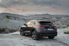 an audi suv is parked in the desert