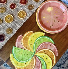 slices of fruit are arranged on the table to be used as decorative plates and serving platters