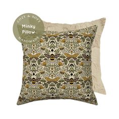 a pillow with an animal print on it and a tag for the label that says minky pillow