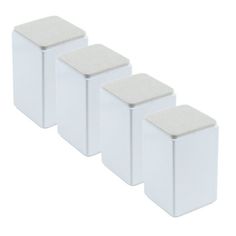 three white square containers sitting next to each other