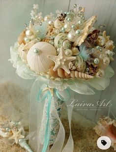 a bridal bouquet with seashells and pearls