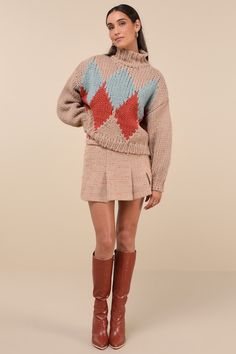 As the snow falls, cozy up in the Little Lies Cabin Cuteness Taupe Multi Diamond Pattern Pullover Sweater! Chunky, cotton-blend knit shapes a darling, multicolored diamond pattern, framed by long sleeves with drop shoulders and fitted cuffs. Relaxed bodice has a mock neckline and a lightly cropped hem. Ribbed knit at neckline, cuffs, and hem. Fit: This garment fits true to size. Length: Size small/medium measures 21" from shoulder to hem. Bust: Great for any cup size. Waist: Not Fitted - comfortable room throughout midsection. Undergarments: May be worn with any standard bra. Fabric: Fabric is very stretchy. Unlined. 65% Cotton, 35% Viscose. Cold Water Wash With Similar Colours. Do Not Bleach. Dry Cleanable. Do Not Tumble Dry. Imported. Lulus | Cabin Cuteness Taupe Multi Diamond Pattern Pu Cozy Long Sleeve Argyle Sweater, Cozy Argyle Pattern Long Sleeve Sweater, Winter Cotton Argyle Sweater, Winter Argyle Pattern Tops, Winter Argyle Knit Sweater, Knit Sweater With Argyle Pattern And Long Sleeves, Snow Falls, Sweater Chunky, Mock Neckline