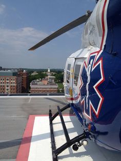 a helicopter parked on top of an airport tarmac