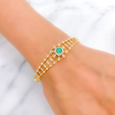 This exquisite 22k gold bangle bracelet, weighing 13.9 grams, features a stunning viridescent design adorned with dazzling diamonds and a cultured emerald. The yellow gold finish enhances its luxurious appeal, making it perfect for any special occasion. The bangle is set with 0.87 carats of F-G color, VS quality diamonds in round brilliant cut shapes and features an oval-shaped cultured emerald. With an oval opening of 2.3 inches, this piece offers both elegance and comfort. The bangle is openab Elegant Gold Bangle With Emerald, Green Bangle For Formal Occasions, Fine Jewelry Style, Yellow Gold Emerald Bangle Bracelets, Green Diamond Bangle As A Gift, Yellow Gold Emerald Bangle Bracelet, Yellow Gold Emerald Bracelets For Wedding, Green Diamond Bangle As Gift, Green Diamond Bangle For Gift, Green Diamond Bangle Bracelet For Formal Occasions