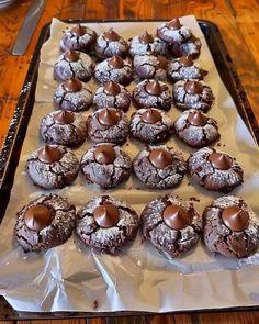 there are many chocolate cookies on the tray