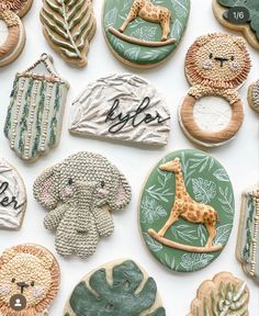 decorated cookies are arranged in the shape of animals