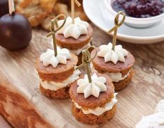 small desserts are arranged on a wooden board