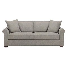 a gray couch sitting on top of a white floor