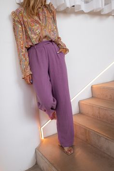 Purple, flowy linen pants/trousers with a zipper and clip fastener in addition the pants have two pockets on the front with two faux pockets on the back, These pants are the perfect bottom for the summer season; they are lightweight yet high-quality and can't forget the dreamy shade of purple! Our model wears the Ecru and Purple Floral Auda Top and Orange and Golden Zelia Shirt Colors : purple - beige Not lined Not sheer Sizes: S / M / L S: Length 43.31 in - Width 12.60 in M: Length 43.70 in - W Linen Straight Pants With Side Pockets, Straight Linen Pants With Side Pockets, Summer Ankle-length Linen Cargo Pants, Linen Bottoms With Side Pockets For Fall, High-waisted Linen Cargo Pants, Trendy Linen Bottoms With Pockets, Spring High-waisted Linen Cargo Pants, Chic Linen Pants With Pockets, High-waisted Linen Cargo Pants For Spring