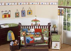 a baby crib bedding set with animals on it