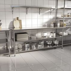 an industrial style kitchen with stainless steel shelvings and pots and pans on the counter