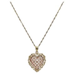 14k rose and yellow gold filigree heart pendant necklace. Pendant measures to be 20.5mm x 20.5mm, comes on an 18 inch diamond cut twist chain, has a spring ring to open and close necklace, and necklace has a total weight of 3.2 grams. Heart Shaped Diamond Pendant, Filigree Heart, Gold Filigree, Heart Pendant Necklace, Diamond Cut, Spring Rings, Necklace Pendant, Diamond Pendant, Heart Pendant