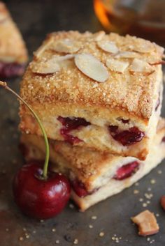 three pieces of cake with cherries and almonds