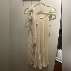 Gorgeous Pleated Dress With Adjustable Straps That Tie Into Bow. Scoop Neck And Back. Very Flowy And Flattering. 100% Polyester Dress With 100% Silk Lining. Hits Mid-Thigh For Average Height. Chic Cream Chiffon Dress, Off White Mini Dress For Spring Formal, Elegant Cream Mini Dress For Casual Occasions, Cream Pleated Evening Dress, White Silk Pleated Dress, Flowy Cream Dress Elegant, Elegant Flowy Beige Mini Dress, Elegant Cream Mini Dress For Spring, Elegant Cream Flowy Dress