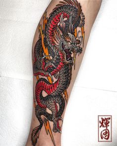 a man with a dragon tattoo on his leg