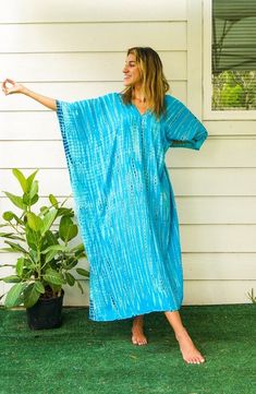 "Add a touch of unique style to your wardrobe with our Hand-Dyed Kaftan Dress! This stunning dress is made from 100% breathable and comfy rayon fabric, ensuring maximum comfort all day long. Using the traditional Shibori method, each dress is carefully hand dyed, resulting in a one-of-a- kind masterpiece. The intricate patterns and vibrant colors make this dress a true work of art. The kaftan dress comes in a versatile one size fits most (M-3XL), making it extremely comfortable for a wide range Tie Dye Clothing, Dress Loose Fit, Tie Dye Outfits, Dye Dress, Dress Beach, Beach Wear Dresses, Tie Dye Dress, Dyed Dress, Kaftan Dress