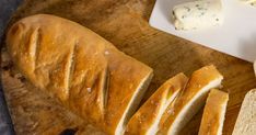 sliced bread and butter on a cutting board