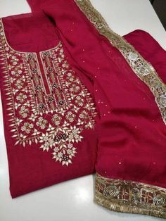 Item Overview ATHARVA Hand Embroidered Salwar Kameez/Chanderi Shirt/Reds/Gota Chiffon Dupatta/Custom Stitch Unstitch/Custom Anarkali/Plazzo/Pants Dno. CH1651 Fabric: * Shirt: Chander Silk - Embroidered Neck/ 2.5 Mts Beautiful Hand Embroidery * Dupatta: Chiffon Chinnon Dupatta 2.5Mts/ Latkans Tassels (Motifs may wary)/Exclusive Gota Patti work Border * Bottom Santoon Taffeta Silk 2.5 Mts. Excusive Hand Embroidered Party Wear Punjabi Suit. Customization: * Fabrics Customization: Designs Can be mad Traditional Gota Work Palazzo Set For Party, Traditional Palazzo Set With Gota Work For Party, Bollywood Style Embroidered Georgette Sets, Festive Straight Kurta Palazzo Set In Shantoon, Traditional Palazzo Set With Mirror Work For Eid, Festive Shantoon Palazzo Set With Straight Kurta, Diwali Palazzo Set With Mirror Work, Bollywood Style Embroidered Chanderi Palazzo Set, Festive Shantoon Palazzo Set With Resham Embroidery