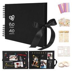 an open photo album with ribbon and stickers on the cover, surrounded by other items