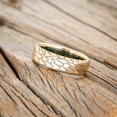 Product Details Ring Style: "Echo" is a handcrafted, custom embossed men's wedding ring featuring a dragon scale engraving with a moss lining. It can be customized to feature just about any embossed design you can dream up. Width: The width of the ring pictured is 6mm, but can be ordered in a custom width accompanied by a design change fee. Please state your desired width in the Custom Requests section during checkout, and we will reach out to you for payment. Customizable: Because each ring is Staghead Designs, Men's Wedding Ring, Dragon Scale, Embossed Design, Ceramic Rings, Detailed Ring, Ring Pictures, Men Jewelry, Unique Materials