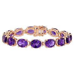 This bold tennis bracelet is intricately crafted in rose-plated sterling silver and features 15 oval-cut, prong-set glistening African-amethysts set in a classic tennis bracelet design. The high polished rose plated sterling silver complements the gemstones for a luxurious look. Instantly elevate any ensemble with this trendsetting gemstone bracelet. Bracelets Purple, Silver Tennis Bracelet, Amethyst Set, Elegant Bracelet, Pretty Bracelets, Amethyst Bracelet, Gold Plated Bracelets, Pink Bracelet, Amethyst Gemstone