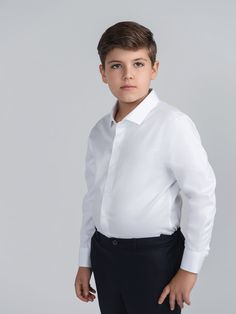 This dapper white dress shirt is tailored from 100% cotton making it comfortable and formal. With clear buttons and a cutaway collar this shirt can be worn with any blazer, cardigan or even on its own its a show stopper. This shirt is a whiter white compared to previous seasons. There is no stretch to this shirt please consider sizing up to the wide for a more relaxed fit. Wide sizes are 2 inches wider on the chest and waist compared to the regular sizes. See sizing chart for reference. Model 1 Professional White Long Sleeve Shirt, White Business Casual Shirt With Lapel Collar, White Lapel Collar Shirt For Business Casual, White Dress Shirt With Spread Collar For Office, Smart Formal Shirt With Fold Down Collar, Classic White Dress Shirt For Office, Cotton Dress Shirt With Lapel Collar For Formal Occasions, White Button-up Dress Shirt For Office, White Collared Dress Shirt For Office