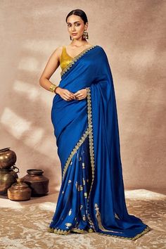 Blue saree crafted in raw silk with bloom embroidered borders and Potters touch motif foil embroidery on the pleats and palla. Comes with a foil printed unstitched blouse piece crafted in tissue. - Aza Fashions Silk Pre-draped Saree With Embroidered Border For Reception, Slub Silk Pre-draped Saree With Dori Work For Navratri, Blue Slub Silk Pre-draped Saree With Unstitched Blouse, Navratri Slub Silk Pre-draped Saree With Dori Work, Pre-draped Slub Silk Saree With Dori Work For Diwali, Diwali Pre-draped Slub Silk Saree With Dori Work, Pre-draped Saree With Embroidered Border In Slub Silk, Festive Slub Silk Saree With Embroidered Border, Slub Silk Pre-draped Saree With Embroidered Border