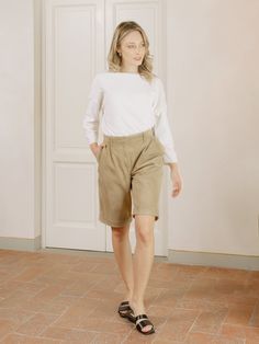 Our Hailee Suede Leather Bermuda Shorts are the perfect foundational piece for your summer wardrobe. Cut from soft lambskin suede, the high-rise waist and wide-leg of these shorts creates a versatile tailored silhouette and an androgynous design. Effortlessly stylish and contemporary, elevating even the simplest of looks has never been simpler. Beige Relaxed Fit Bermuda Shorts For Work, Fall High-waisted Beige Shorts, Elegant Wide Leg Beige Shorts, Beige Knee-length Workwear Shorts, Chic High Waist Bermuda Shorts For Work, Fall Workwear High-waisted Shorts, Chic Beige High-waisted Bermuda Shorts, Beige High-waisted Shorts For Work, Chic High-waisted Beige Bermuda Shorts