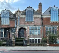 an old brick building with many windows on it