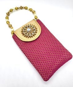 Product Description Mobile pouch style handbags with beaded string Great for holding mobile with your ethnic wear while enjoying the occasion. Back of the bag has a zipped pocket for additional space to hold cards Dimensions: 7" x 4.5" Weight: ~ 3 Oz each Material: Raw silk fabric Design: HBG#191 Pink Rectangular Pouch For Festivals, Traditional Gold Shoulder Bag For Daily Use, Traditional Pouch For Daily Use, Traditional Pink Rectangular Pouch, Traditional Pouch For Daily Use And Festivals, Traditional Rectangular Potli Bag For Everyday Use, Traditional Potli Bag For Daily Use And Festivals, Traditional Pouch For Everyday Use And Festivals, Traditional Shoulder Bag With Mobile Phone Holder As Gift