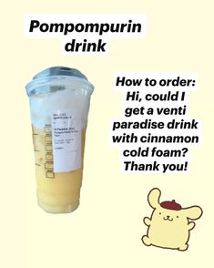 a cup with some liquid in it sitting next to a sticker that says pompompurin drink